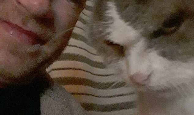 A man has paid nearly £16,000 to have his pet cat cryogenically frozen at a specialist facility in Switzerland, in the hope that medical advances will one day bring her back to life. Mark McAuliffe is pictured with his beloved Bonny
