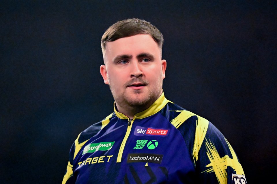 Darts player Luke Littler in his uniform during the 2025/26 World Darts Championship final.