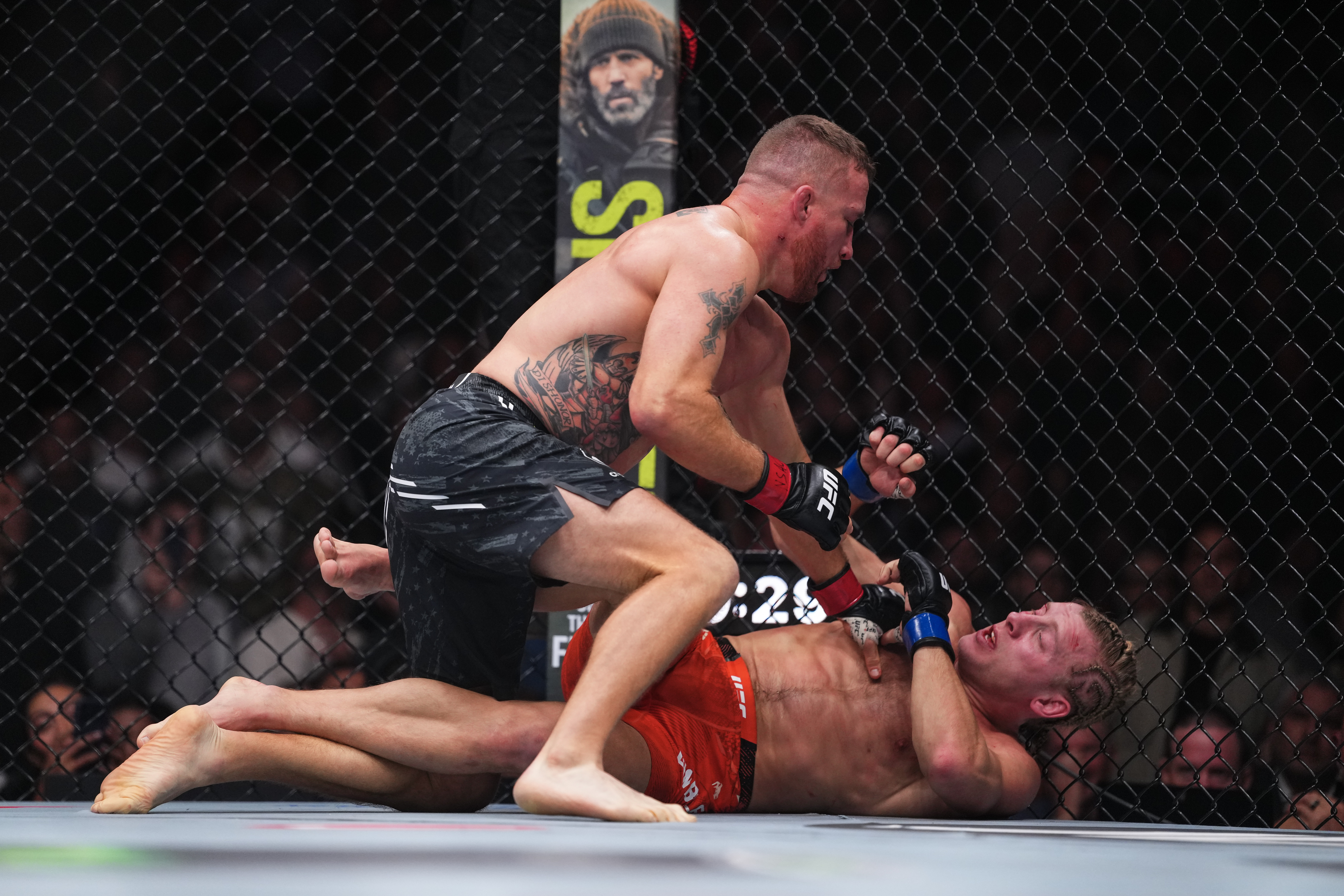 Justin Gaethje wrestling Paddy Pimblett in a UFC championship bout.