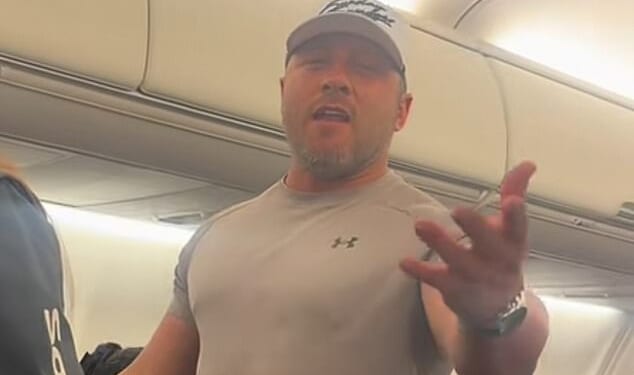 An angry, unidentified male flyer was seen on video having a dramatic outburst on board a Southwest Airlines flight. According to social media users, he was upset over a man talking to his wife