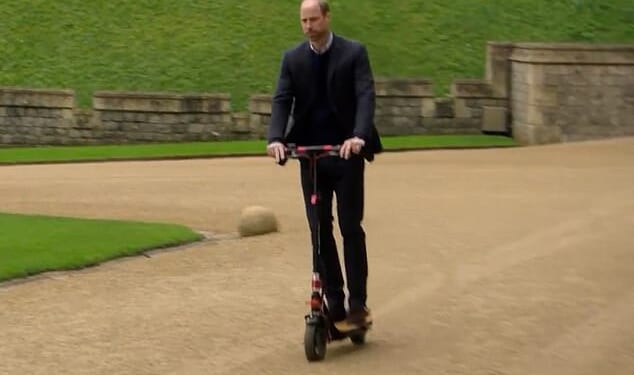 Prince William has reportedly been banned from riding his e-scooter within the ground of his new home in Windsor Great Park. He is seen here riding his scooter during an episode for Eugene Levy's Apple+ TV series The Reluctant Traveler
