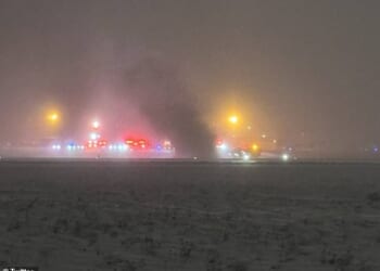 A photo from the scene shows the smoking plane on the runway at the Bangor airport
