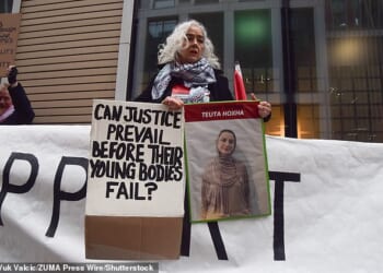 A protester holds a picture of Teuta Hoxha during a demonstration outside the Department of Health in solidarity with pro-Palestine activists. One of the strikers, Heba Muraisi, a 31¿year¿old lifeguard and florist, who lives in Barnet, north London, has now gone without food for 69 days