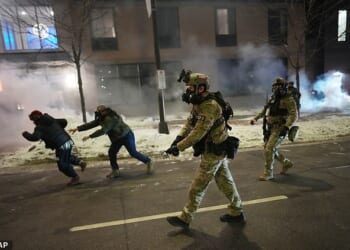 Authorities cleared out the crowd of protestors in front of the hotel on Sunday night