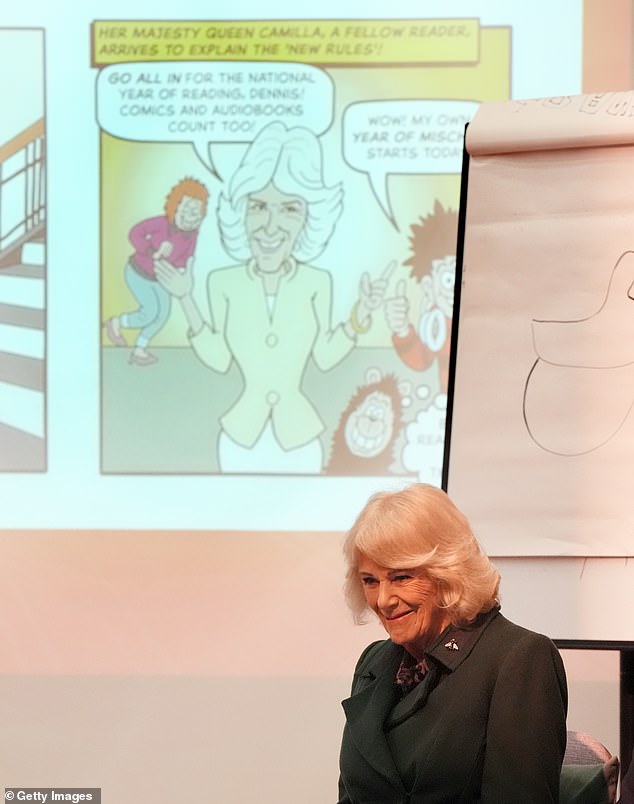Camilla holds the framed Beano comic strip featuring herself which was presented to her during the visit