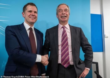 Robert Jenrick and Reform UK leader Nigel Farage answer questions from the media during the Reform conference in London following the former Tory's defection