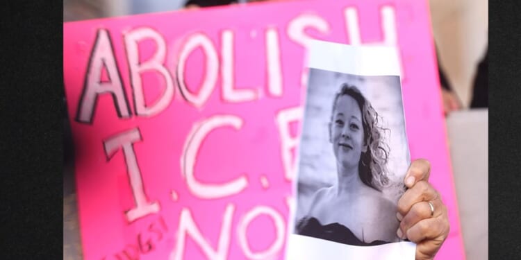 A protester holds an "Abolish ICE" sign and a picture of Renee Good, who was fatally shot Wednesday while apparently driving her car toward a federal immigration officer. Good has been portrayed as an innocent observer, but new information indicates she was active in a nationwide activist group called "ICE Watch."