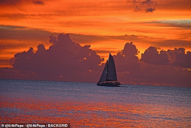 The dreamy view from their boat pictured above