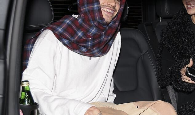 Romeo Beckham and his girlfriend Kim Turnbull couldn't stop smiling as they stepped out together in Paris amid his older brother Brooklyn's scathing post towards his family