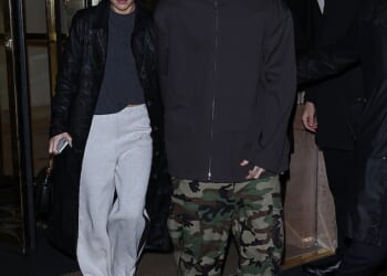 Romeo Beckham and his girlfriend Kim Turnbull continued their Paris Fashion Week parade on Sunday, nearly a week on from his brother Brooklyn's bombshell statement