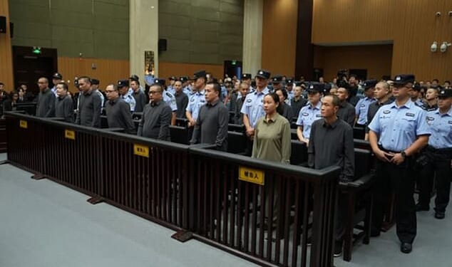 China has executed 11 people linked to Myanmar criminal gangs, including 'key members' of telecom scam operations (pictured, some of the crime family at their sentencing in October at the Wenzhou Intermediate People's Court in eastern China's Zhejiang Province)