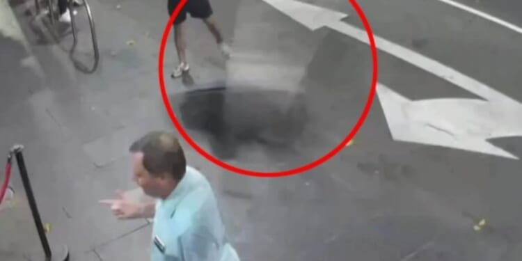 Shocking moment man is floored after being struck by a flying chair outside strip club as he's being kicked out of venue