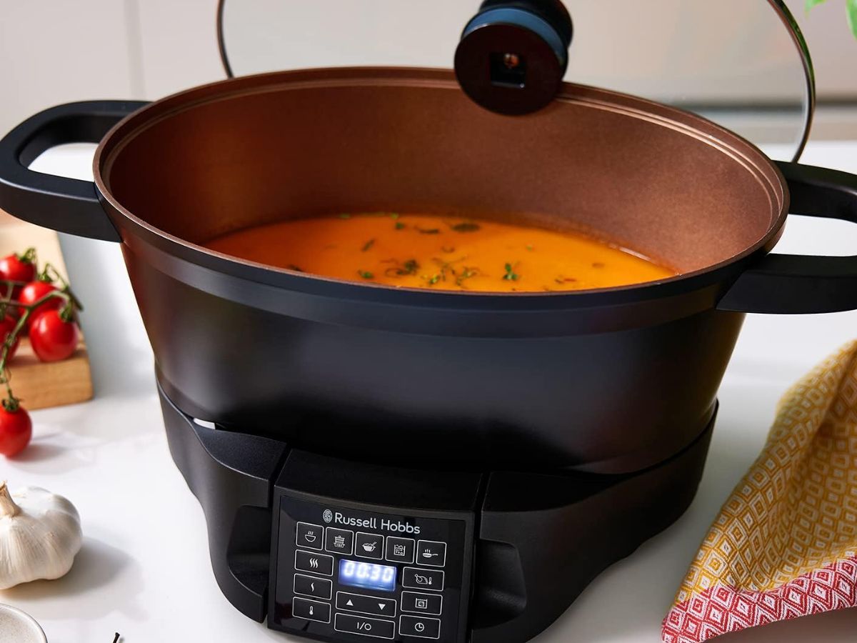 Russell Hobbs multi-cooker filled with soup, displaying 00:30 on its timer.