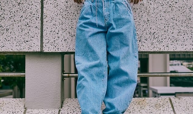 Men have been sharing the women's clothing items that 'give them the ick,' including baggy jeans and sneakers (stock image)