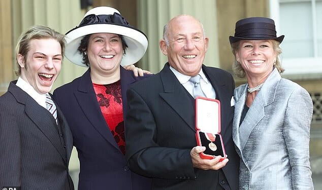Sir Stirling Moss and his wife Susie accompanied by Elliot and Allison as he collected his knighthood at Buckingham Palace