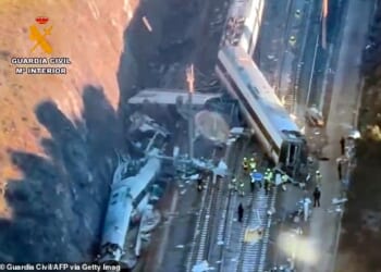 At least 39 people are confirmed dead following a high-speed train collision in southern Spain. Pictured: Emergency workers are seen at the site where a high-speed Iryo train derailed and was hit by another train as rescue efforts continue in Adamuz, southern Spain, on January 19, 2026