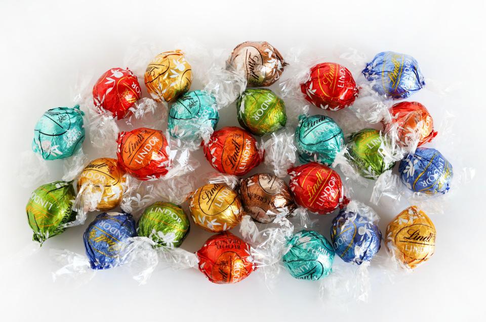 Assorted Lindt Lindor Swiss chocolate truffles in colorful wrappers.