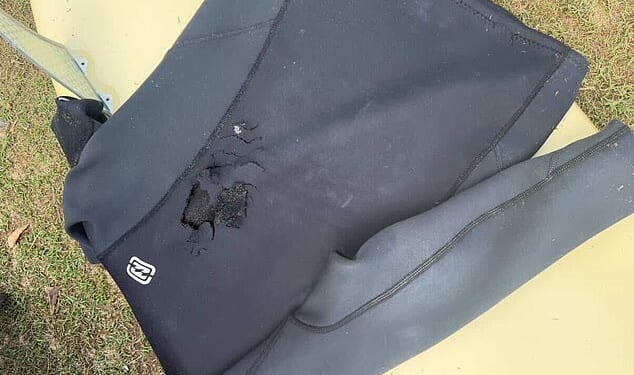 A surfer had minor injuries from being bitten by a shark Tuesday in the fourth attack off the coast of Australia's most populous state in three days. It's understood the shark bit through the man's wetsuit and took a chunk out of his board