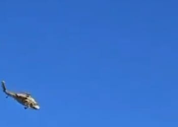 Terrifying moment helicopter being flown by second chopper breaks free and falls to the ground after harness failed