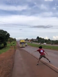 Terrifying moment idiot teen plays twisted game of ‘chicken’ with huge 12-wheeler lorry nearly causing horror crash