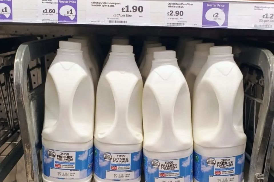 An image collage containing 1 images, Image 1 shows Tesco-branded milk bottles displayed for sale in a Sainsbury's store