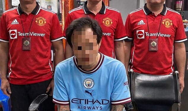 Thai police mocked the Man City fan arrested on suspicion of drug possession, surrounding him with their red United jerseys
