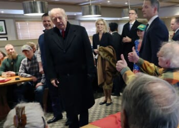 President Donald Trump greets patrons as he visits the Machine Shed restaurant on Jan. 27, 2026, in Urbandale, Iowa.