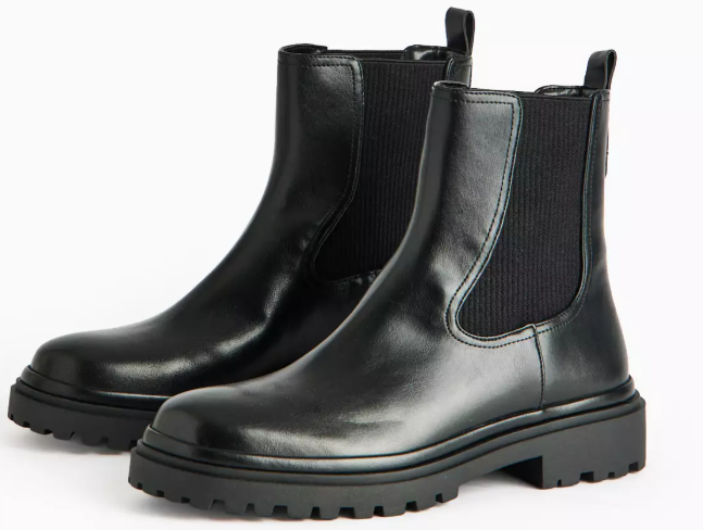 Pair of black Chelsea boots with lug soles.