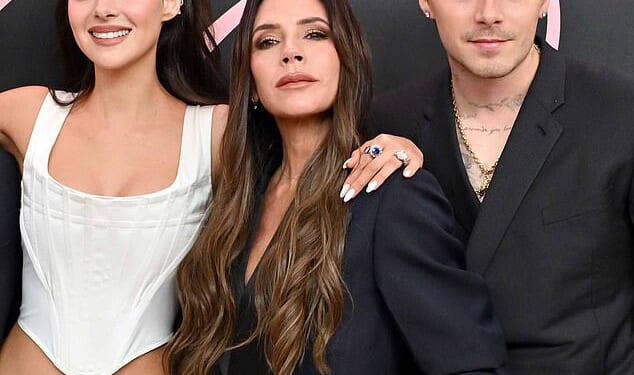 Victoria Beckham has been left 'devastated' after taking the brunt in the vicious family fallout with son Brooklyn and his wife Nicola Peltz - which has all been sparked by a trademark battle over their family name (pictured in February 2024)