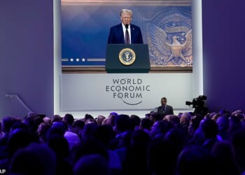 Attendees listen to a virtual speech delivered by U.S. president Donald Trump, at the Annual Meeting of World Economic Forum in Davos, Switzerland, Thursday, January 23, 2025