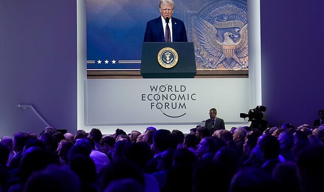 Attendees listen to a virtual speech delivered by U.S. president Donald Trump, at the Annual Meeting of World Economic Forum in Davos, Switzerland, Thursday, January 23, 2025