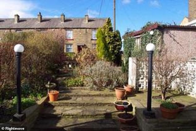 A view of the back garden on the suburban street lined with traditional stone and brick homes where Nosheen lived