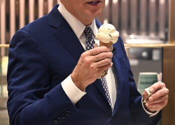 Former president Joe Biden, a self-proclaimed ice cream enthusiast, is seen above eating a cone on Late Night with Seth Meyers in 2024