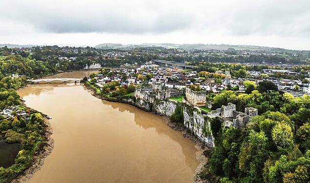 The arrival in recent years of an army of chicken farms on the River Wye's banks has ushered in an astonishing decline in the health of the river (Pictured: the river by Chepstow Castle)