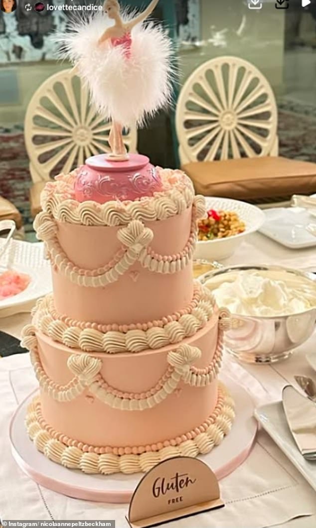 For her birthday, Nicola had a pastel pink cake, adorned with white icing and decorated with a ballerina topper