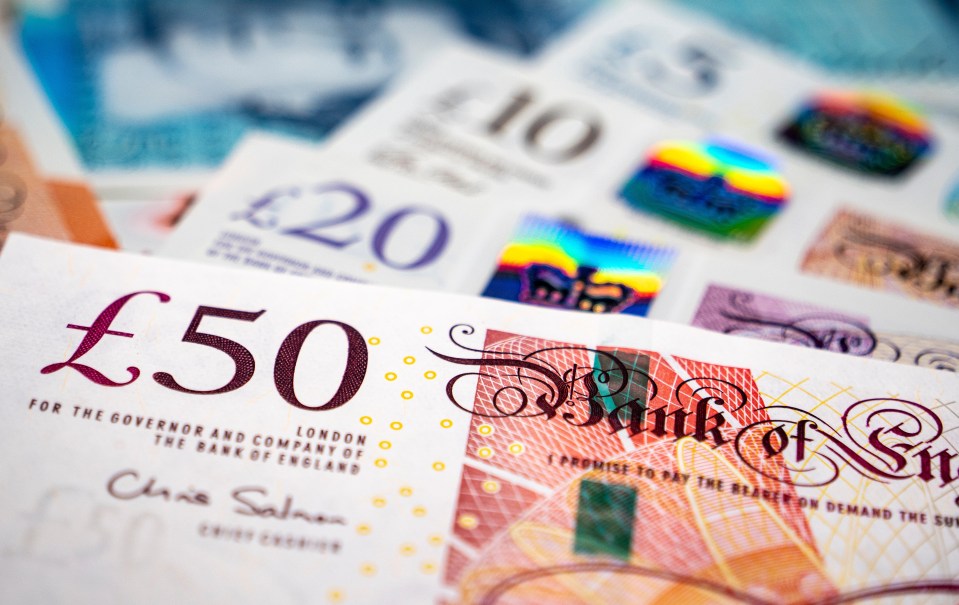 Close-up of British fifty, twenty, and ten-pound notes.