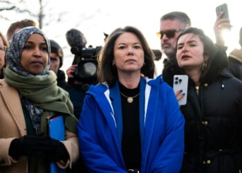 Rep. Ilhan Omar and Rep. Angie Craig arrive outside of the regional ICE headquarters at the Bishop Henry Whipple Federal Building on Jan. 10, 2026, in Minneapolis, Minnesota.