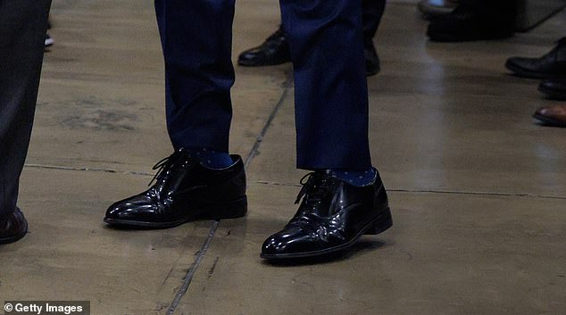 The footwear, the President's favourite formal Oxford shoes, were clearly too big for the US Secretary of State
