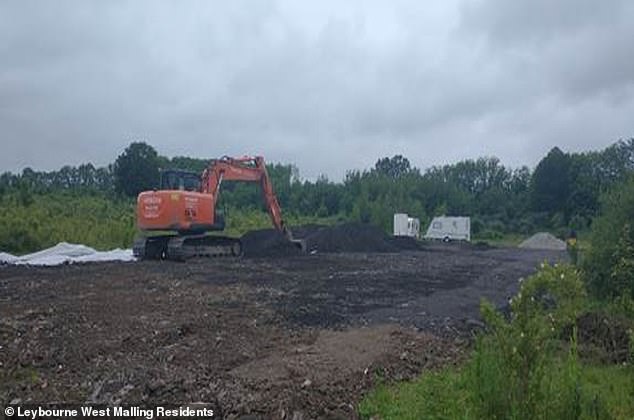 Diggers are seen at the site before it was tarmacked over and a traveller pitch built on it