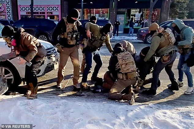Moments before Alex Pretti (on the ground) was fatally shot in the Minnesota city on Saturday