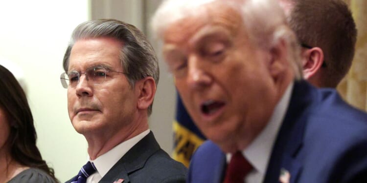 President Donald Trump speaks at a roundtable discussion with farmers in the Cabinet Room of the White House next to U.S. Treasury Secretary Scott Bessent.
