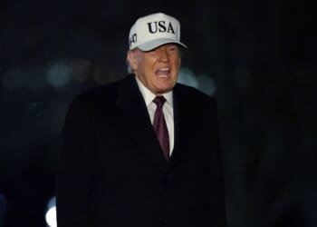 President Donald Trump walks on the South Lawn after he landed at the White House on Jan. 11, 2026, in Washington, D.C.