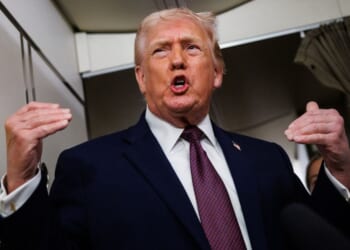 President Donald Trump takes questions from the members of the media aboard Air Force One Sunday en route back to the White House from Palm Beach, Florida.