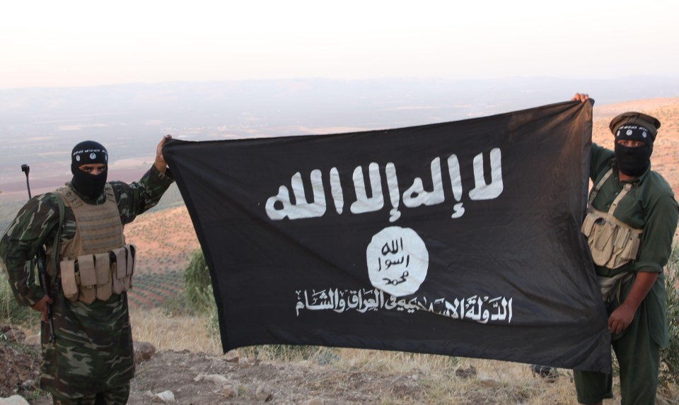 Oct 17, 2013 - Aleppo, Syria - ISIS fighters holding the Al-Qaeda flag with 'Islamic State of Iraq and the Levant' written on it. on the frontline. Islamic State of Iraq and the Levant aka ISIS. The group An-Nusra Front announced its creation January