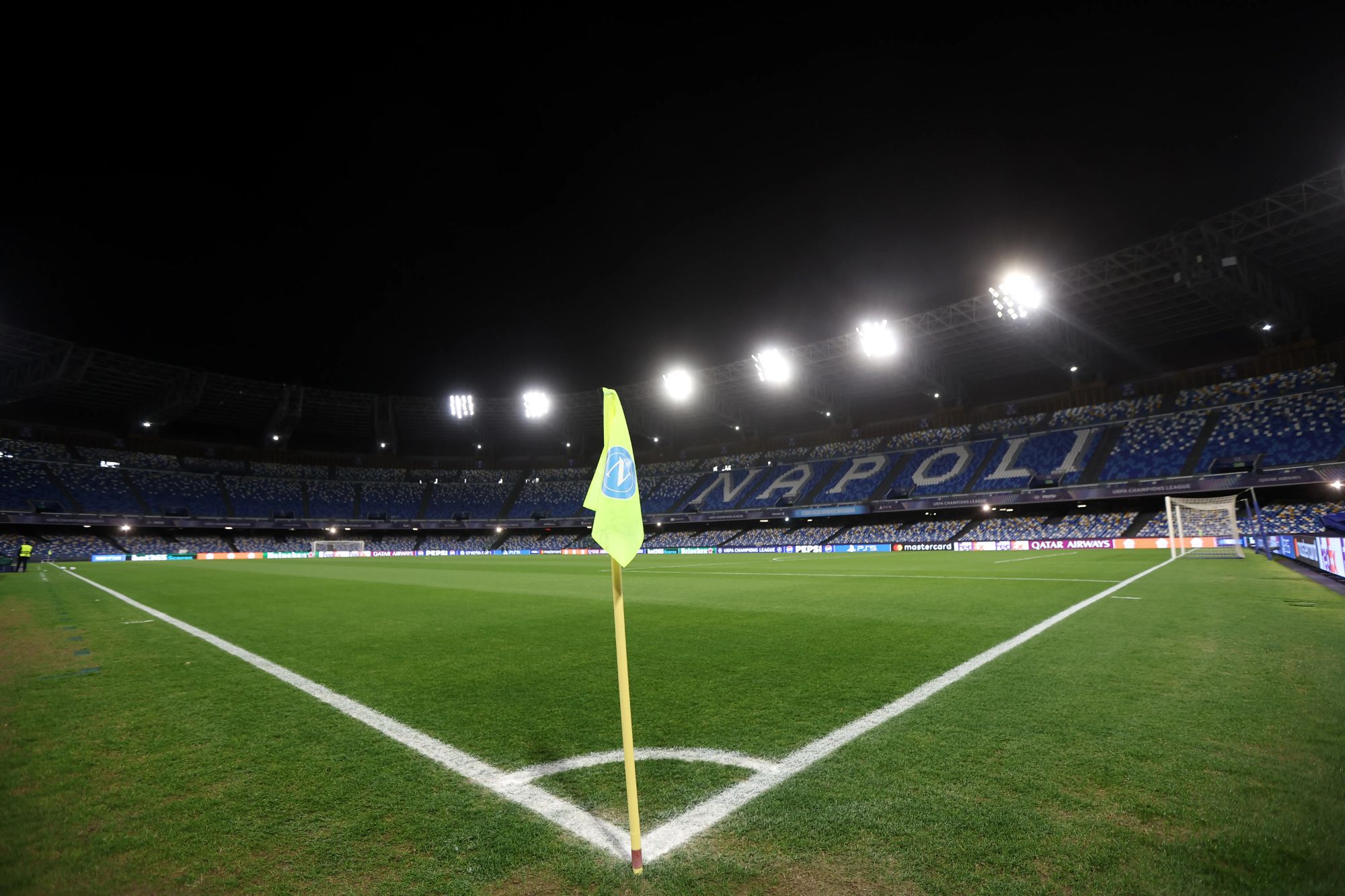 An image collage containing 1 images, Image 1 shows A general view of the Stadio Diego Armando Maradona at night, with the empty stands and the football field illuminated by bright lights