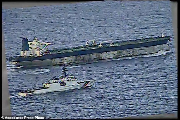 This image from video provided by the U.S. Department of Defense, shows the U.S. Coast Guard cutter Munro shadowing the MV Bella 1 in the North Atlantic Ocean during the maritime interdiction operation Wednesday, January 7, 2026