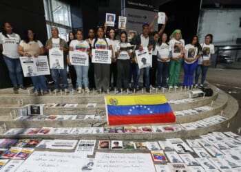 People attend a vigil to demand freedom for political prisoners at El Helicoide, a facility and prison owned by the Venezuelan government and used for both regular and political prisoners of the Bolivarian National Intelligence Service, in Caracas, Venezuela, on Jan. 13, 2026.