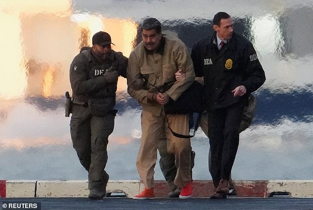 The United States captured Venezuelan President Nicolas Maduro in a raid over the weekend. He is pictured being led by Drug Enforcement agents to federal court on Monday