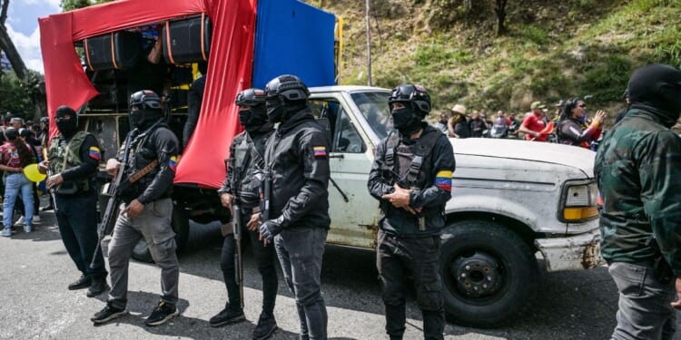 Members of a pro-government group known as the "Colectivos" stand guard during military exercises announced by President Nicolas Maduro in Caracas on Jan. 23, 2025.