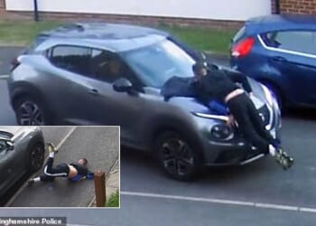 Kieran Hogan's feet lift off the ground as he is hit by the Nissan